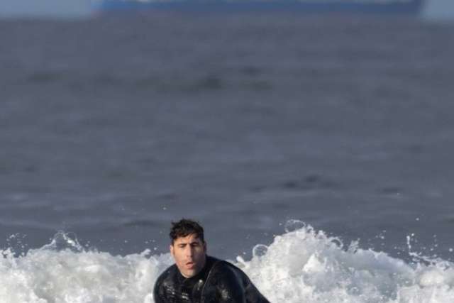 Dr. Sassoon catching a wave