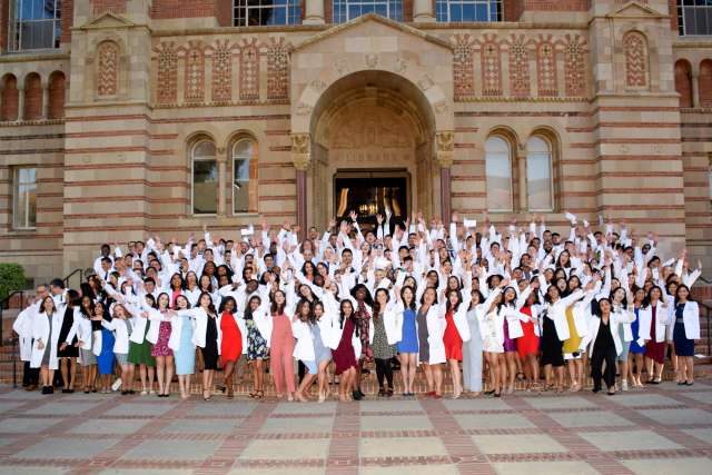Students celebrate following the White Coat Ceremony in February.