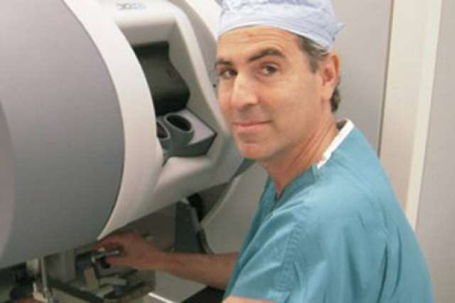 Dr. Robert Reiter using medical equipment.