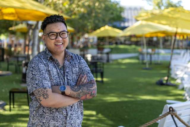 Dany Nguyen posing outside with arms crossed