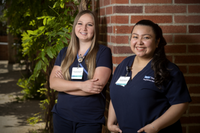 Medical student and mentor smile together in a clinical setting, representing UCLA Health’s mentorship program.