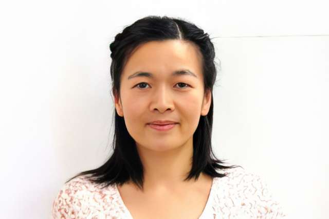 Headshot of Dr. Yahzen zhu facing camera, neutral expression