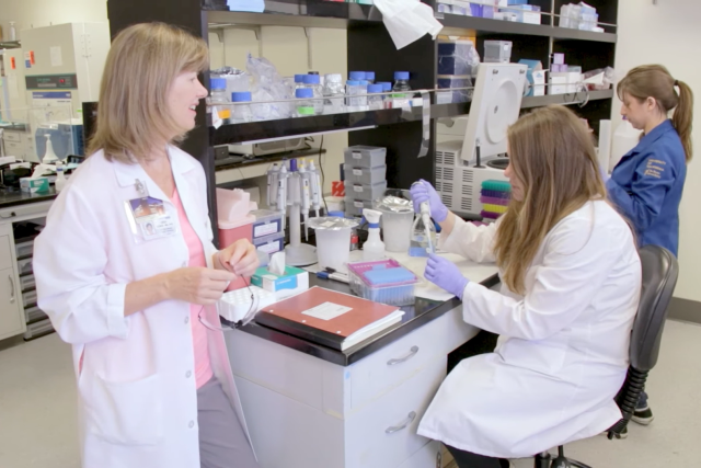 Dr. Demer and two physician scientists working in a lab.
