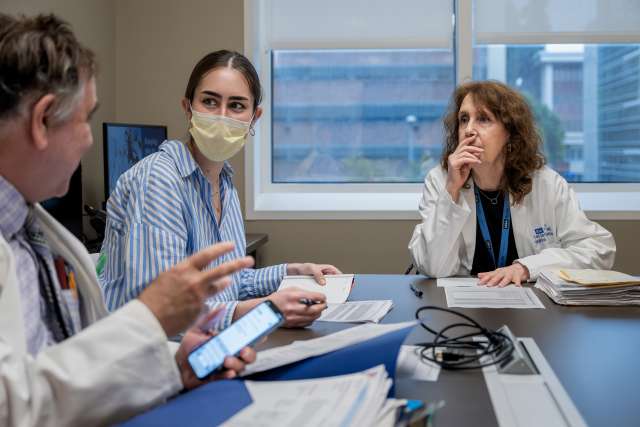 Three doctors in conversation
