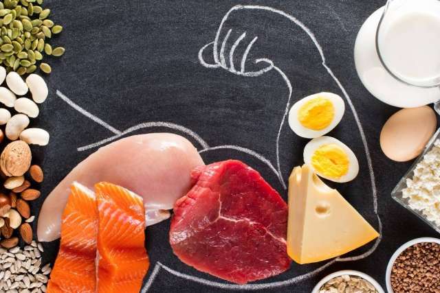 Protein assortment: salmon, steak, chicken, cheese, eggs, milk, nuts