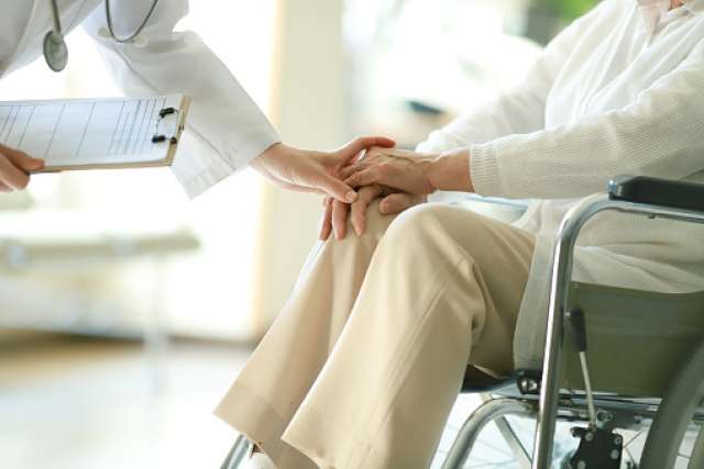 Assisting elderly patient with medical care
