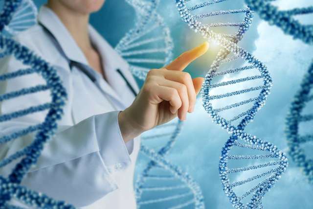 Scientist in lab coat touching glowing DNA strand