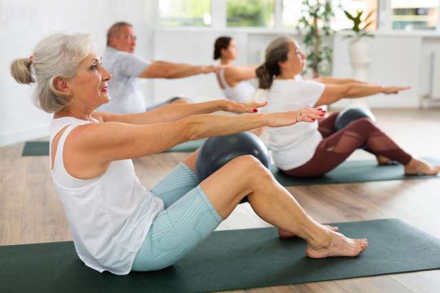 Women exercising on mats