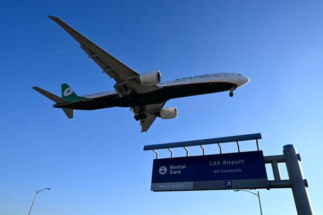 An airplane in the sky near LAX.