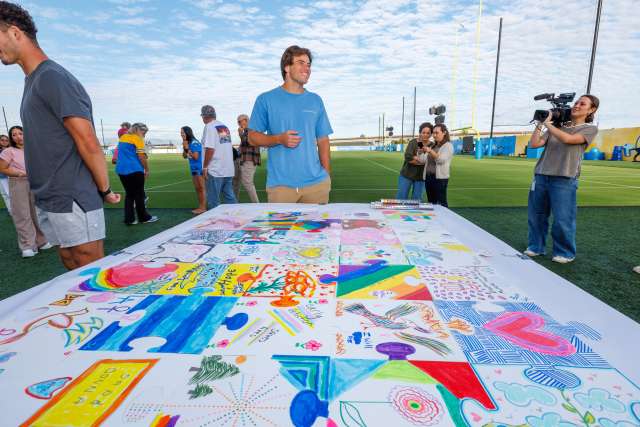 LA Chargers kicker Cameron Dicker with art therapy mosaic.