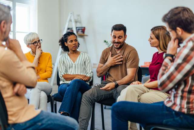 A man speaking in a support group