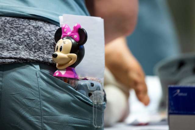 Minnie Mouse rattle in the pocket of Karleen Wray