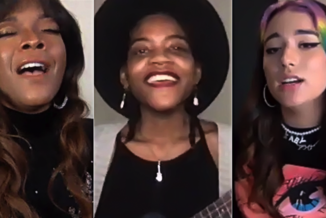 Three women performing together, each with distinctive hairstyles and clothing styles.
