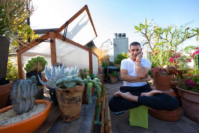 Dr. Edward Zaragoza sits in his garden