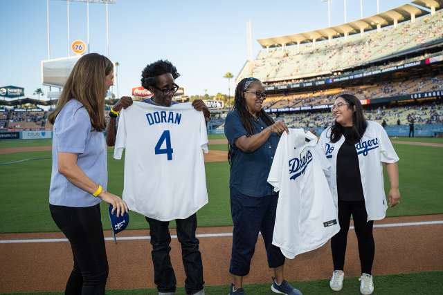 Reed siblings receiving jerseys