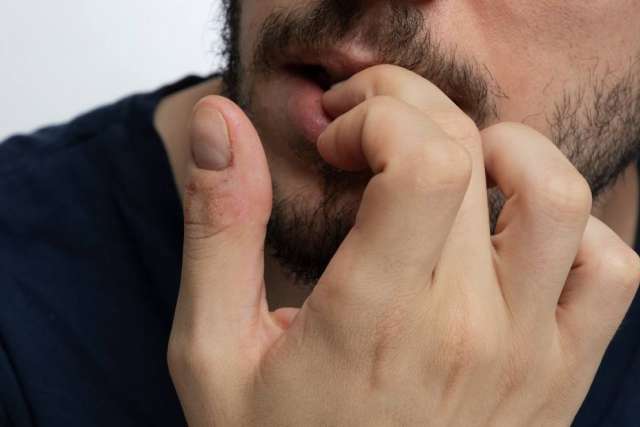 Stop biting your nails: New research suggests that gentle touch could help