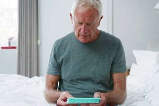 Man in hospital room