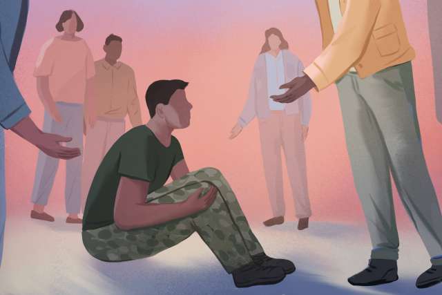 A group of people interacting with a seated man, who appears distressed.