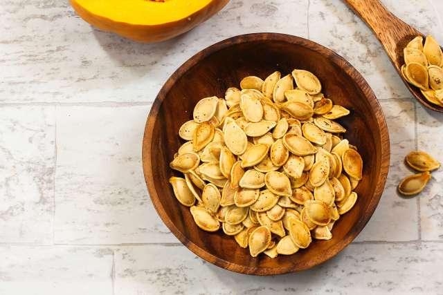 Roasted Spaghetti Squash Seeds in wooden bowl