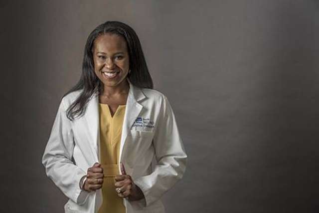 Dr. Fola May