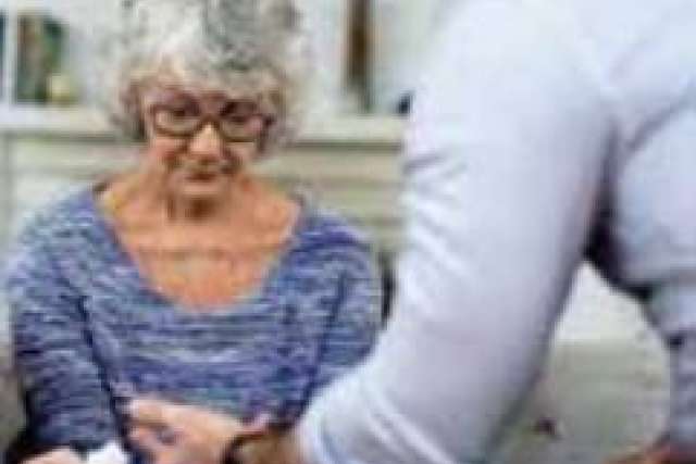 Oder woman having wrist held by person in white shirt
