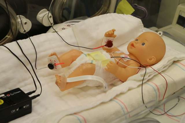 Dr. Ronald Harper’s breathing device connected to a doll