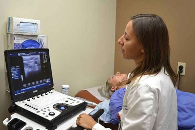 Dr. Livhits with a patient