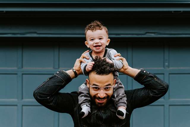 Father holding his baby son