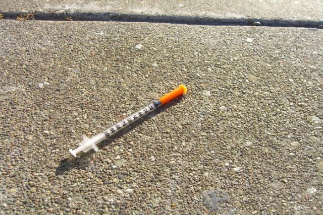 Heroin needle in the street