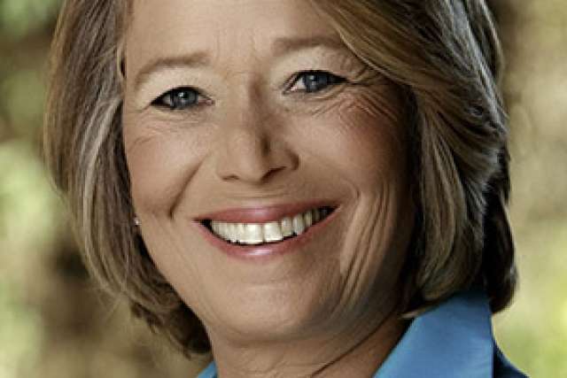 Linda Rosenstock in a blue jacket with a blurred background.