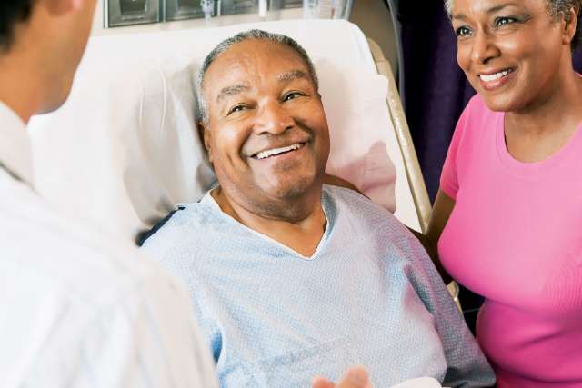 Older Patient with Doctor and Wife