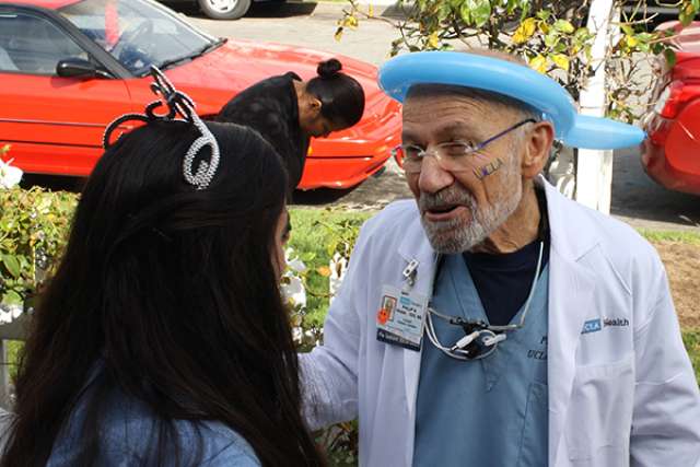 Dr. Philip Trask talking to child