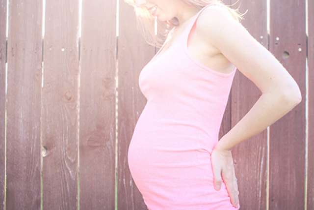 Pregnant woman in sunlight
