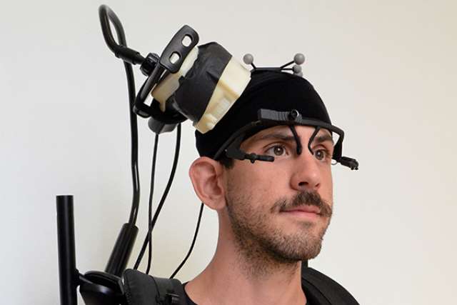A wireless device records each patient's brain waves as he or she navigates an empty room.