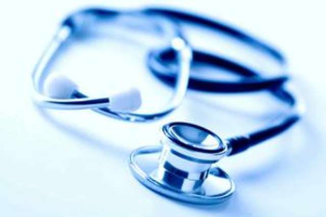 Stethoscope on a light blue background, symbolizing medical care and health.
