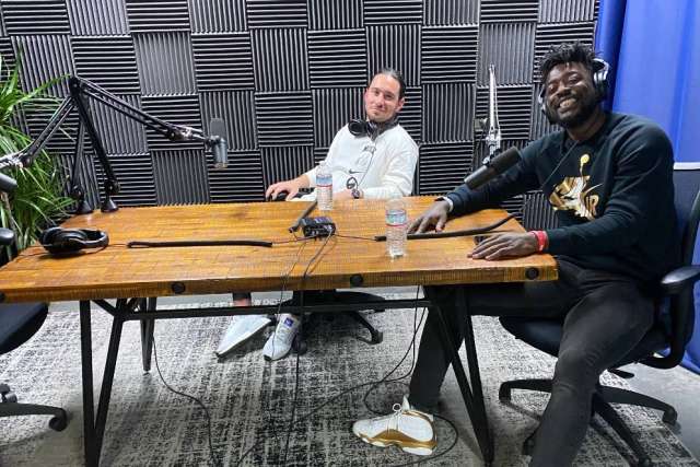 two men sitting in a podcast studio filming for the UCLA BrainSPORT Podcast