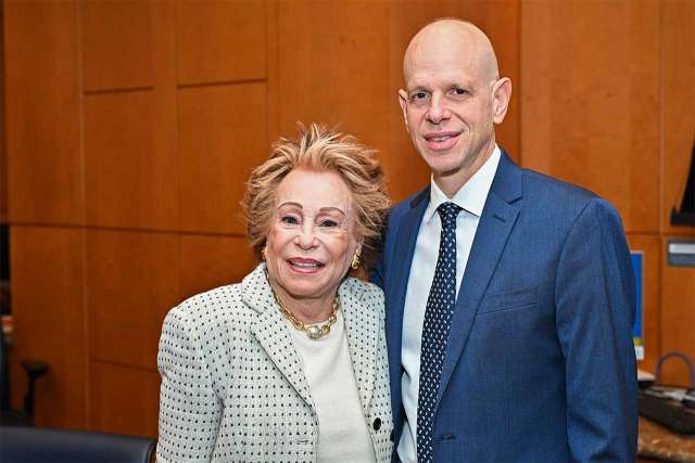 Joyce Brandman and Dr. John Belperio standing together.