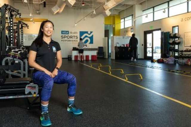 Deviny at Exos UCLA training facility smiling in workout area