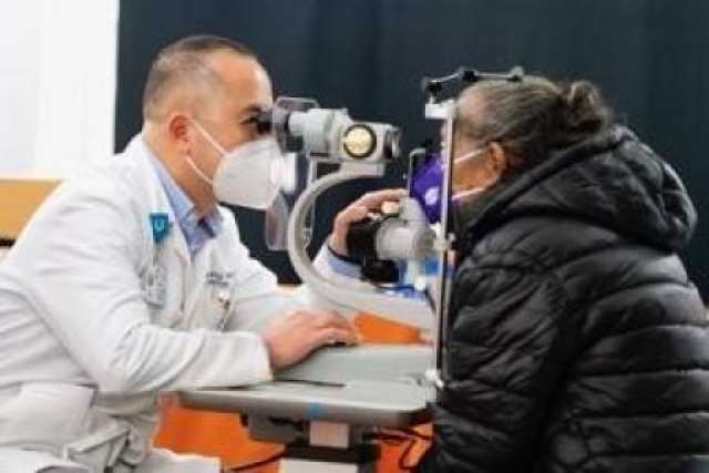 A patient receives an eye exam administered by UCLA Health opthalmologist Dr. Andrew Young, at Care Harbor