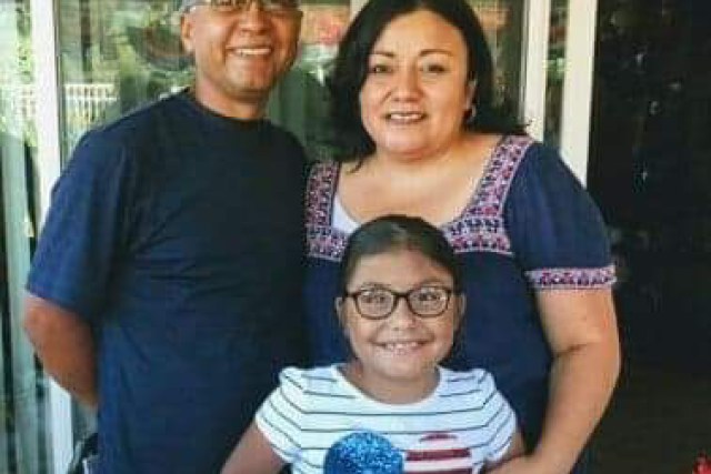 Family of three posing together, thanking Dr. Jeff Veale and the whole Kidney Transplant Team after a successful surgery