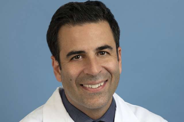 Jamil A. Aboulhosn, MD smiling portrait in white coat
