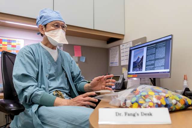 Dr. Zhuang T. Fang collects the hundreds of colorful medicine caps discarded each day in the operating room at UCLA Stein Eye Institute. (Photo by Joshua Sudock/UCLA Health)
