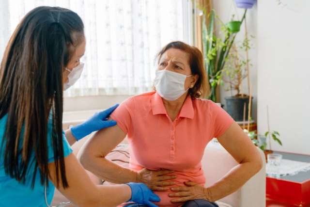 nurse confronting woman in pain