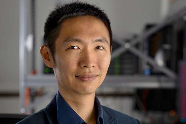 Head-and-shoulders portrait of a melanoma scientist in a lab