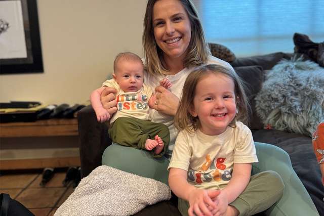 Sabrina Dukhovny sits with her two children, Maddie and her older sister, Jami.