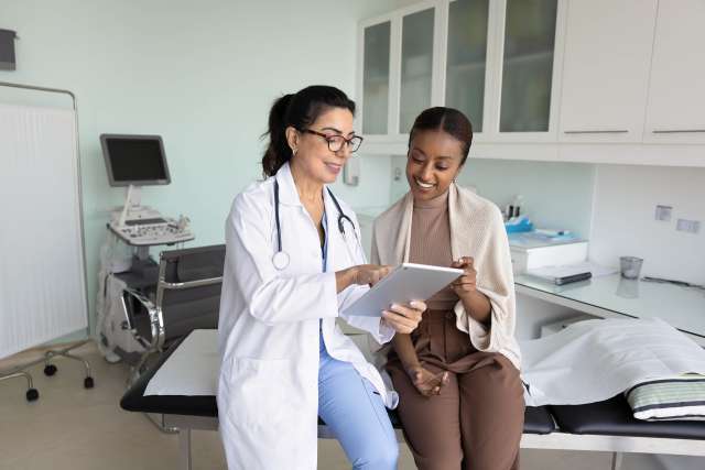 Female doctor and cancer patient in the clinic