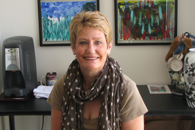 Denise Aberle, diagnostic radiologist, wearing brown polka dot scarf