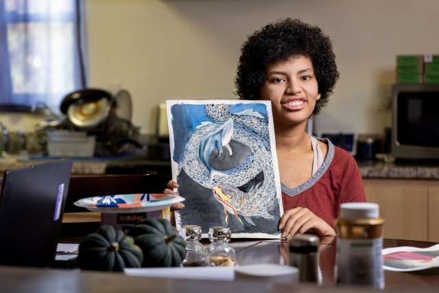 Jade Wilson shows her watercolor painting