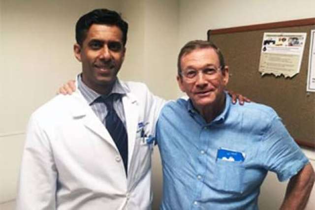 Doctor in white coat with prostatectomy patient at UCLA