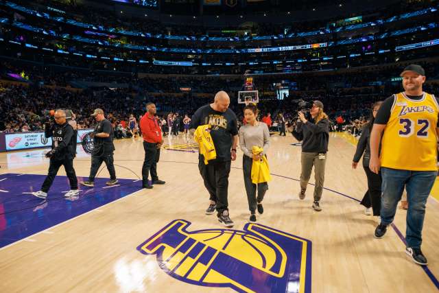 Everett Verigan and Cynthia Palmquist on the Lakers court